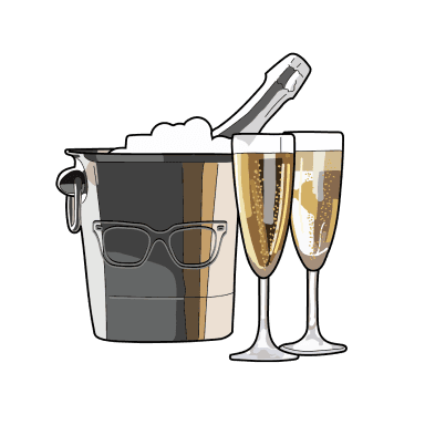 Champagne bottle in a metal bucket next to two champagne flutes